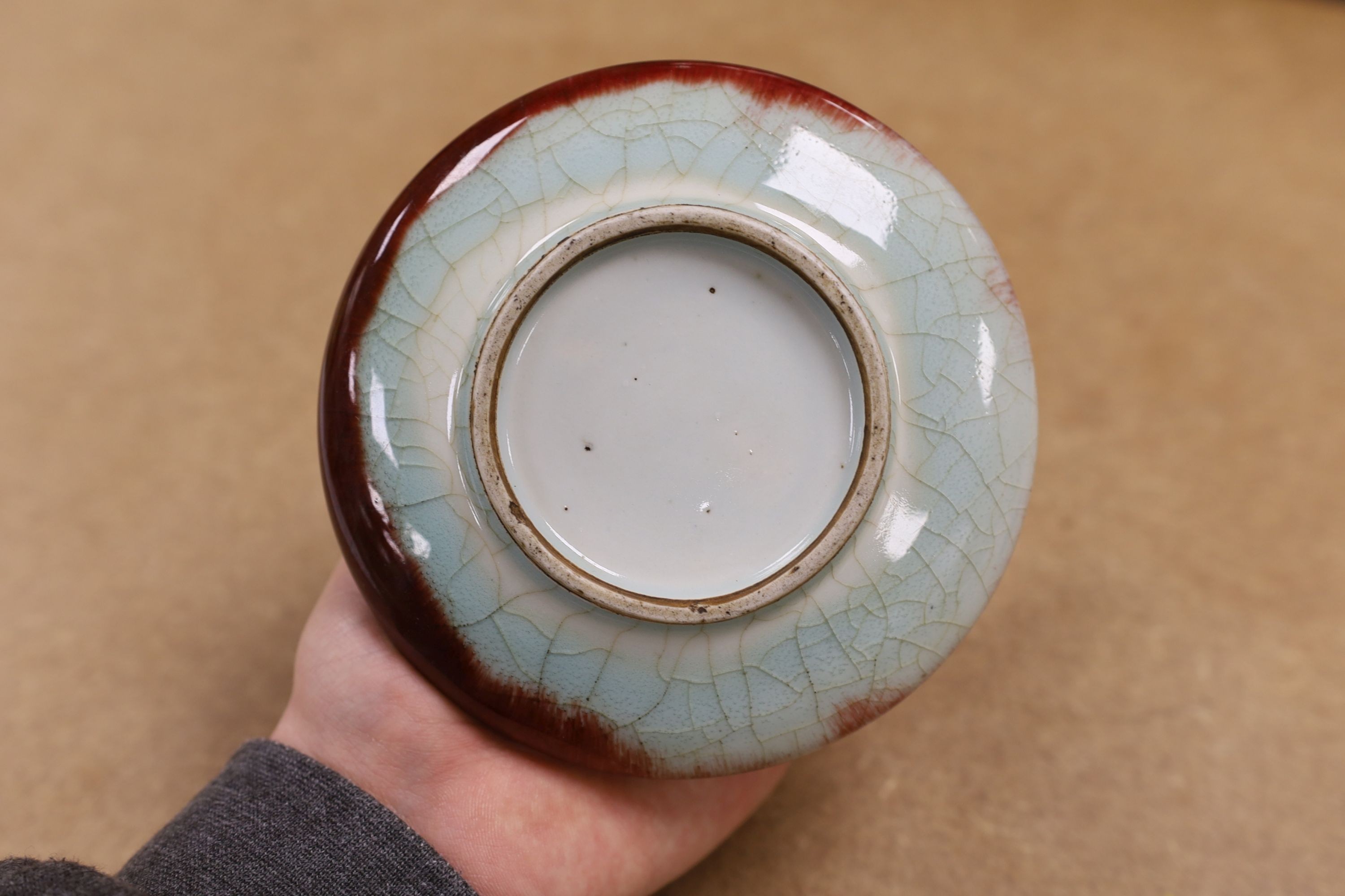 A Chinese enamelled yellow-ground jar and cover, a pottery teapot and cover and a flambe vase, latter 13cm